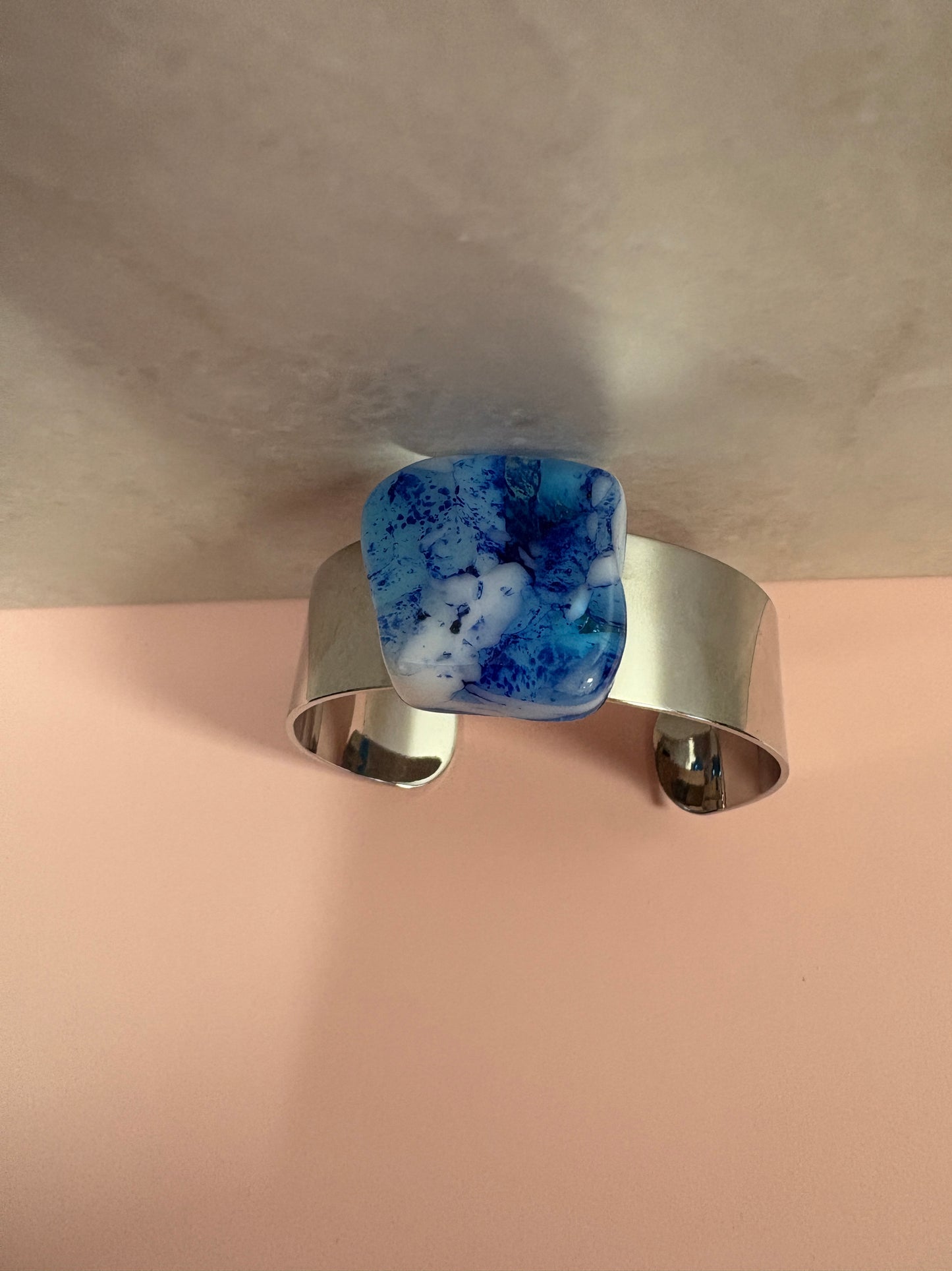 Fused Glass-blue with white irregular shaped glass on a cuff bracelet